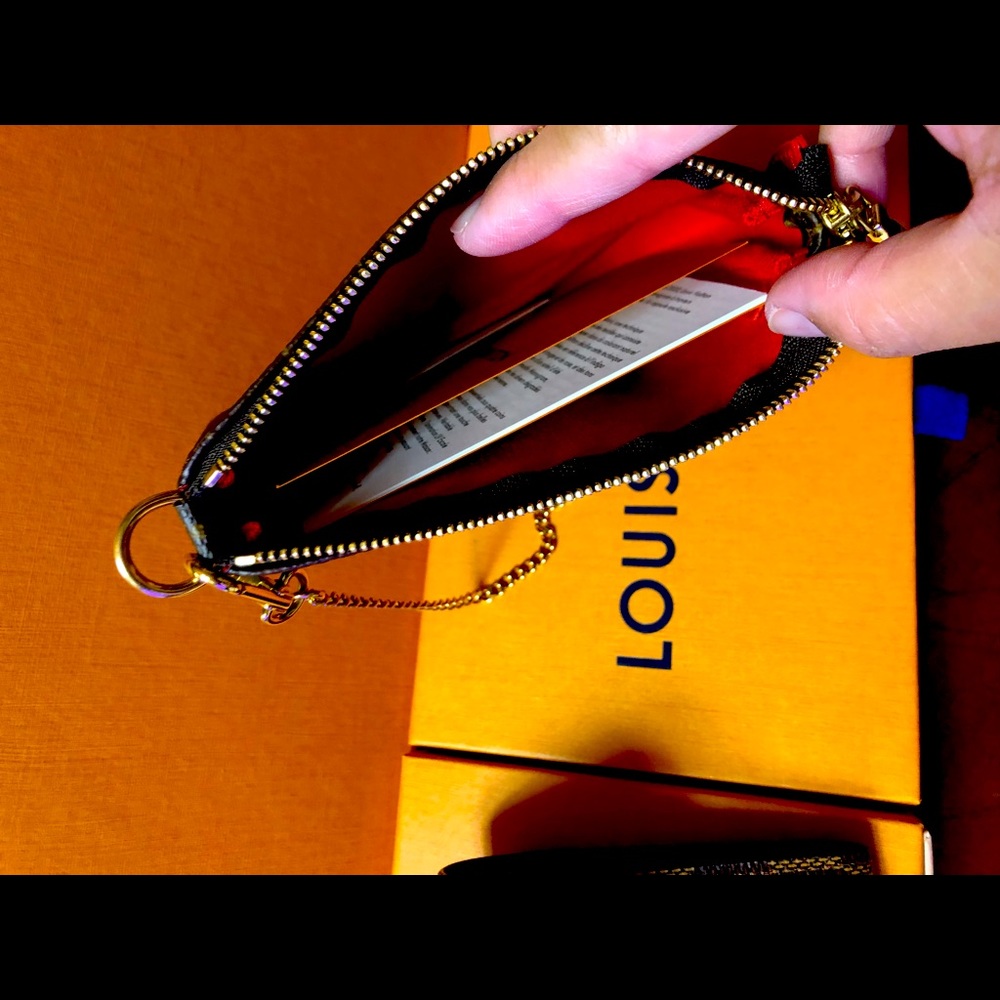 BNIB MINI POCHETTE, Vivienne riding bumper cars.